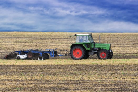 Tractor harrowing