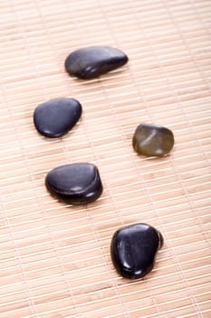 Zen stones on bamboo mat