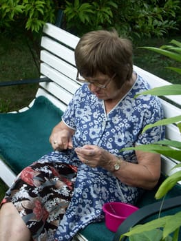 Senior woman doing needlework