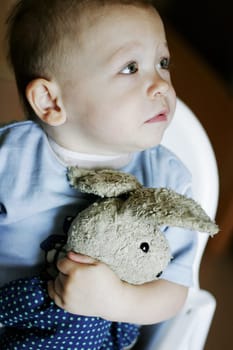 Child and cuddly toy