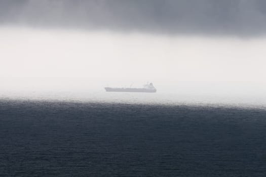 When suddenly a storm came up,it simply had to be recorded. The ship is still in the sunshine,but the dark cloud cover is approaching and darkening everything...