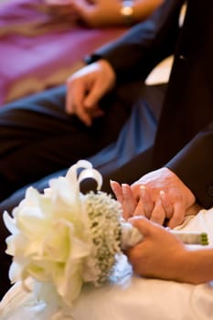 Newlyweds holding hands
