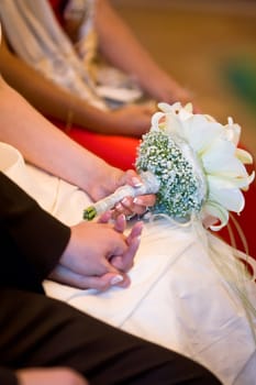 Newlyweds holding hands