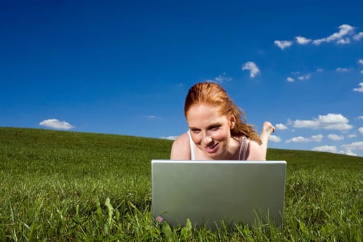 With the notebook on the meadow