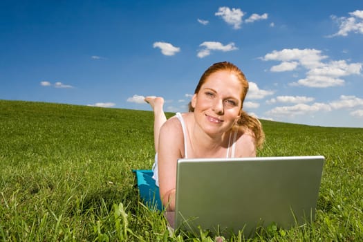 In the grass at the notebook