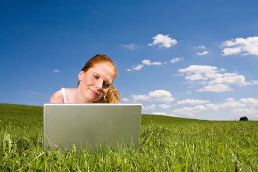 With the laptop on the meadow