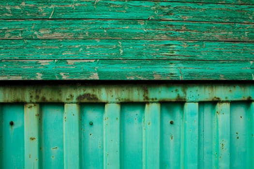 green paint on an old wall (wood and steel)