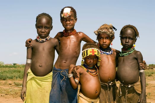 Children of the Galeb tribe in the Lower Omo Valley,in the deep south of Ethiopia,on the Omo River. The tribe has about 20,000 members,divided into clans and small villages like this one.