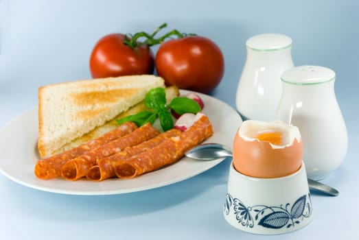 Breakfast with sausage ,toast,butter ,egg