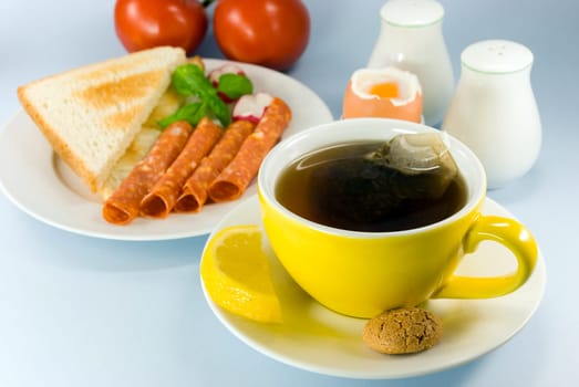 Breakfast with sausage ,toast,butter ,egg 2