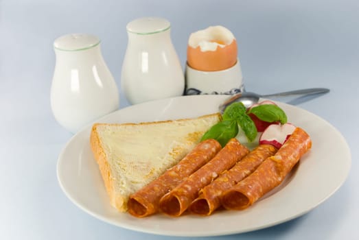 Breakfast with sausage ,toast,butter ,egg 2