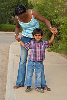 Mother helping child