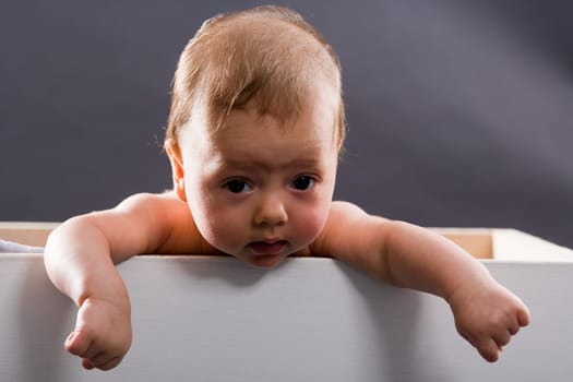 Baby in wooden box