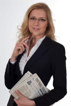 Young woman with stock market newspaper