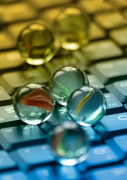 Marbles on notebook keyboard