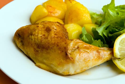 fried chicken leg with salad and