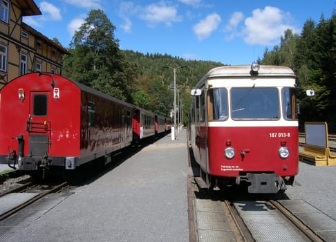 Encounter between a steam locomotive of the Harz narrow-gauge railway and a railcar.
