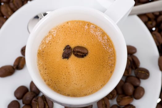 Coffee beans swimming in espresso