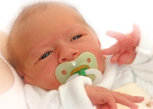 Newborn baby with pacifier