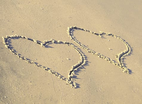 Two hearts on the beach