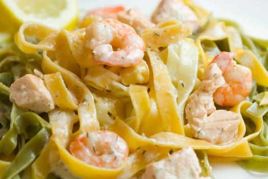 Ribbon noodles with salmon and prawns