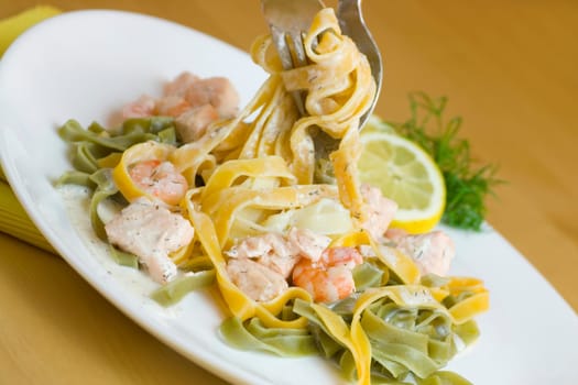 Ribbon noodles with salmon and prawns