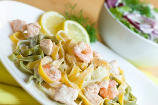 Ribbon noodles with salmon and prawns