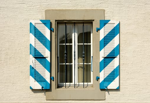Country house with blue and white shutters