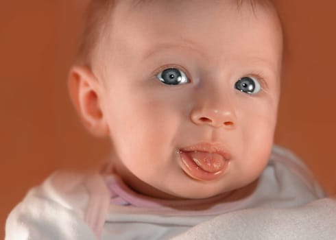 Baby sticks tongue out
