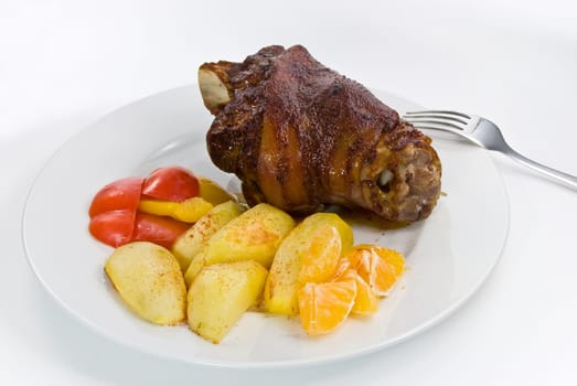 Roasted knuckle of pork with fried potatoes