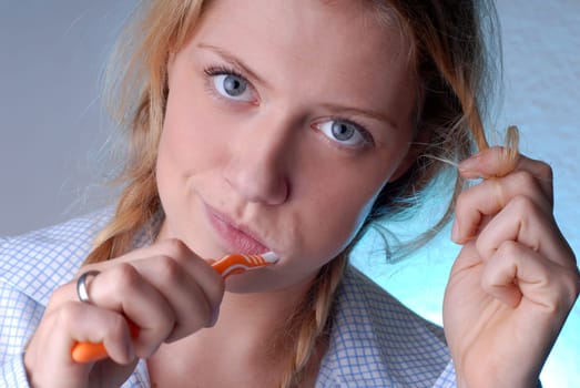 Woman brushing her teeth