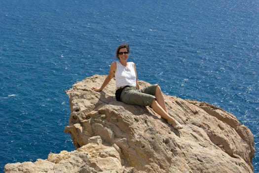 Young woman on rock