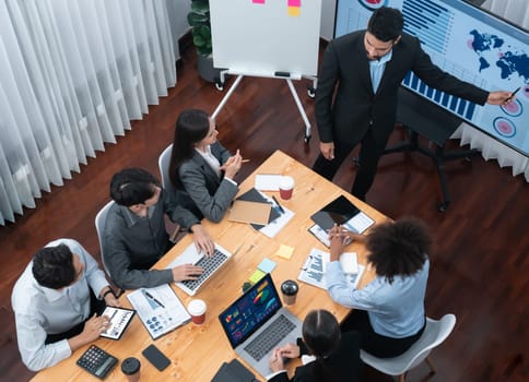 Top view business presentation with data analysis dashboard on TV screen in modern meeting room. Business people brainstorming or working together to plan business marketing strategy. Concord