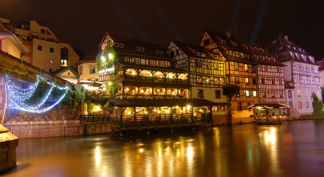Houses on the Ille at night