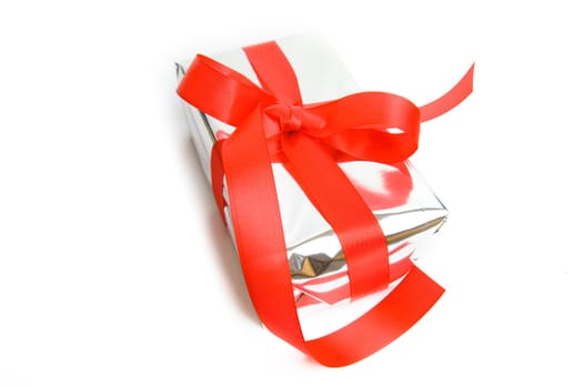 silver gift with red bow