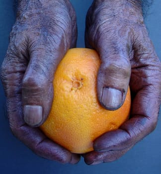 Hands with orange
