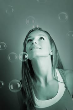 Young woman with soap bubbles