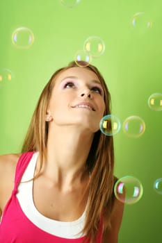 Young woman with soap bubbles