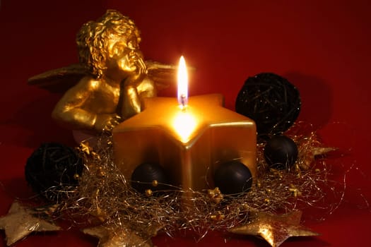 golden candle with golden angel