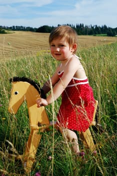Girl with rocking horse