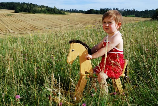 Girl with rocking horse