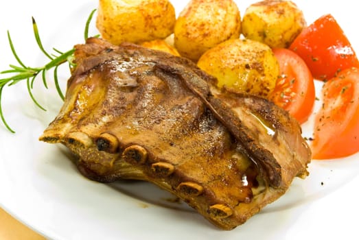 Roasted suckling pig with fried potatoes