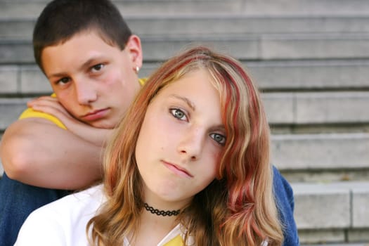 Siblings sit behind each other
