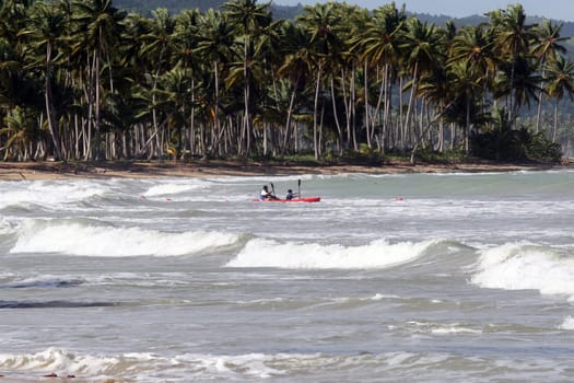 Two kayakers in the open sea