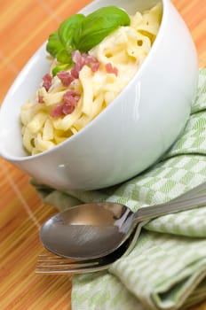 Ribbon noodles in ham and cream sauce