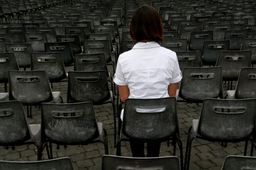 lonely woman with chairs