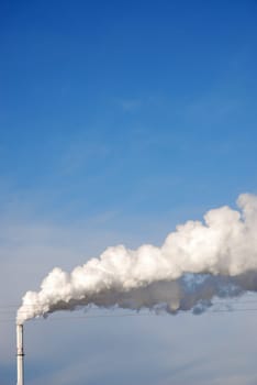 Industrial landscape with smoking chimney
