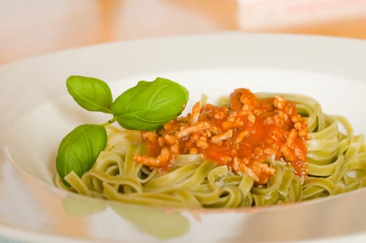 green tagliatelle with Bolognese sauce