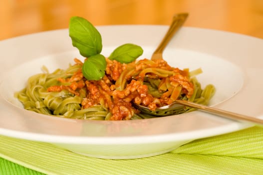 green tagliatelle with Bolognese sauce