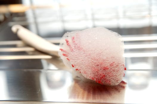 Dishwashing brush with foam